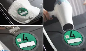 Umweltplakette entfernen: Föhn erwärmt die Scheibe, Küchenrolle und Schaber helfen beim Ablösen.